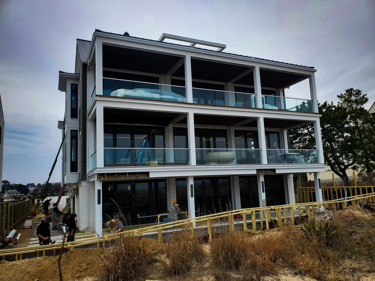 a building under construction with people standing around