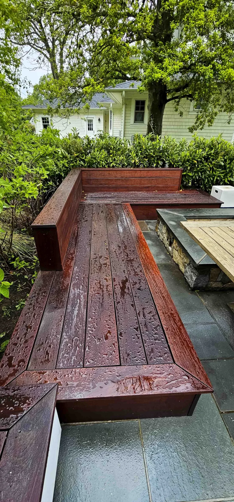 a wooden bench in a backyard