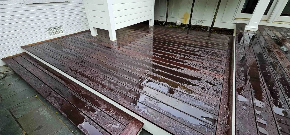 wet wood deck with white walls