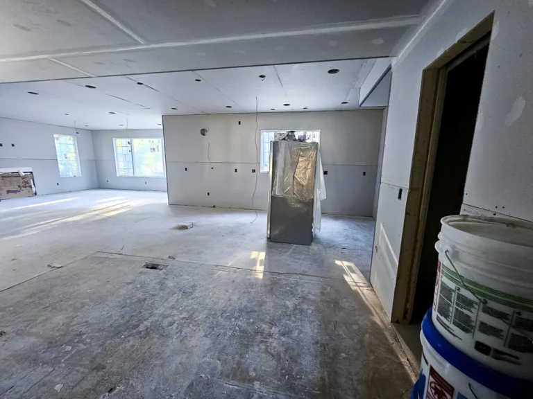 a room with a bathtub and windows